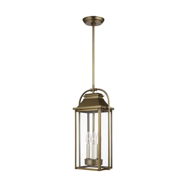 The Wellsworth pendant blends traditional lantern design with subtle nautical influences, featuring durable cast aluminum construction and a warm distressed brass finish. Wet-rated for full outdoor exposure.