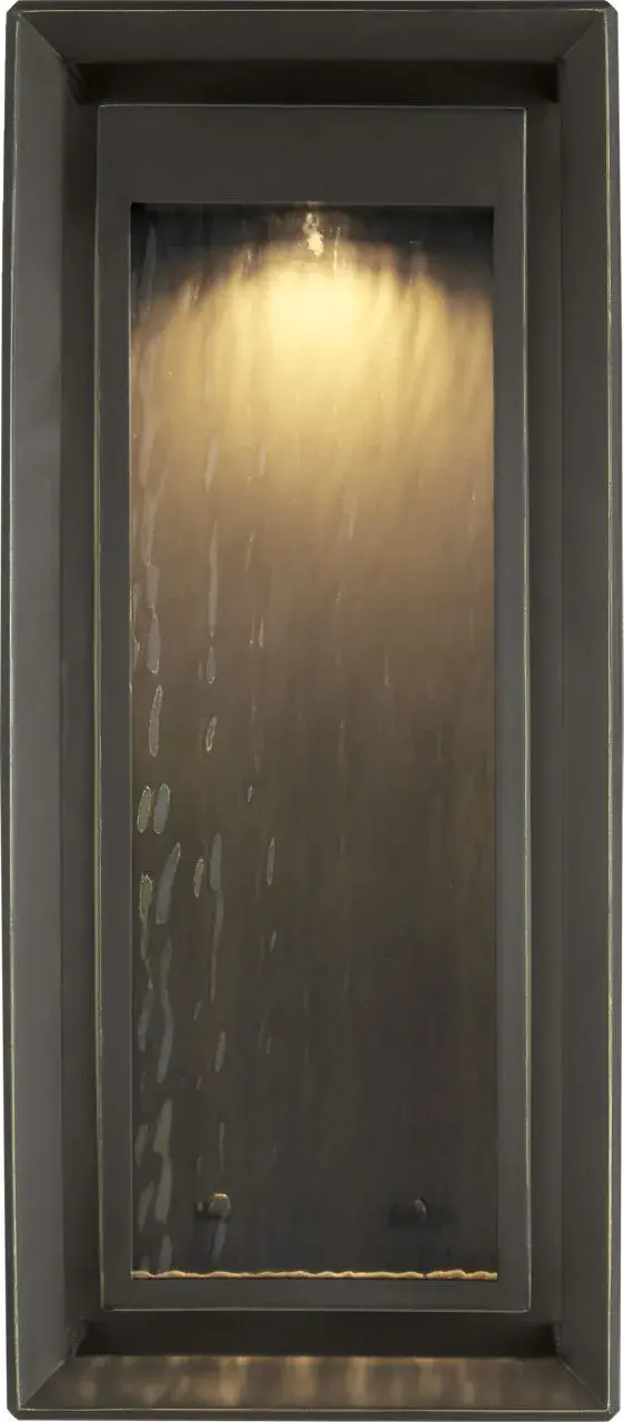 The Urbandale Grande Wall Lantern brings substantial presence and classic elegance to outdoor spaces. Its generous scale and antique bronze finish create a welcoming statement for entryways and porches.