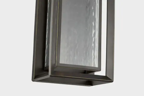 The Urbandale Grande Wall Lantern brings substantial presence and classic elegance to outdoor spaces. Its generous scale and antique bronze finish create a welcoming statement for entryways and porches. - alternate view