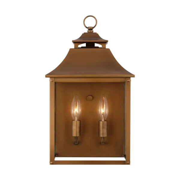 The Galena wall lantern by Sean Lavin brings timeless European elegance to outdoor spaces. Its natural copper finish develops a beautiful patina over time, while clear glass shades showcase candle-style bulbs for warm ambiance.