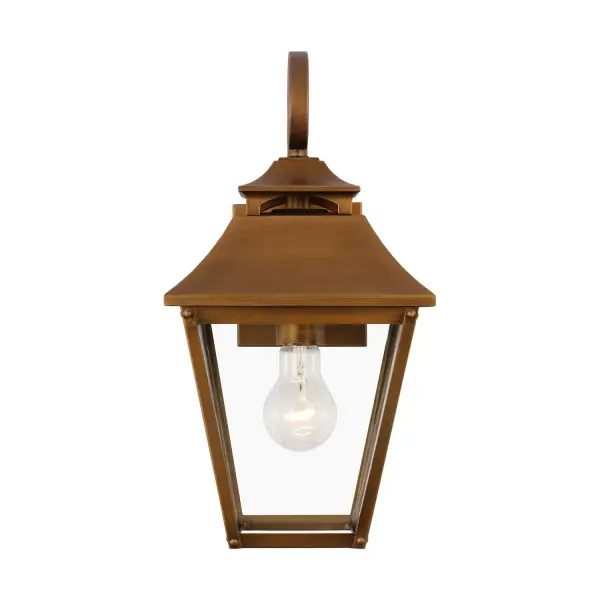 The Galena wall lantern by Sean Lavin brings timeless European elegance to outdoor spaces. Its natural copper finish develops a beautiful patina over time, while the clear glass and candle tube design create warm, welcoming illumination.