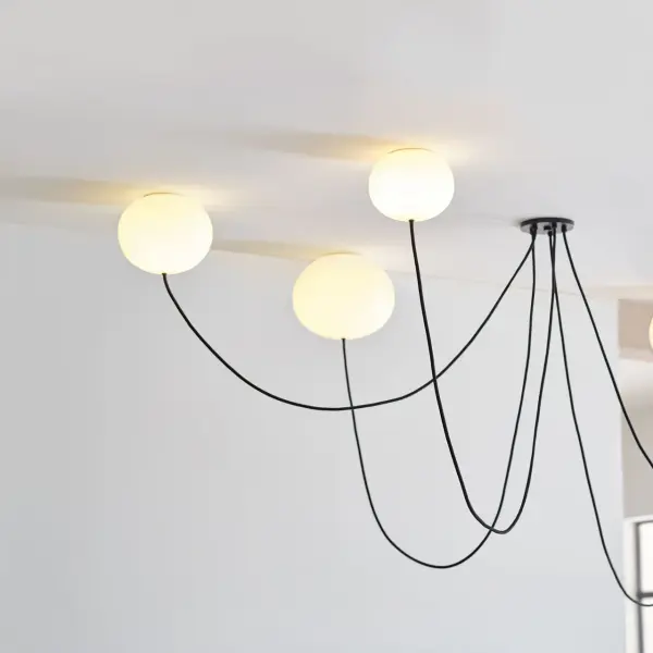 The Helium chandelier combines contemporary elegance with practical illumination. Five opal etched glass shades diffuse warm 2700K LED light beautifully, while the matte black finish adds modern sophistication to any space. - alternate view