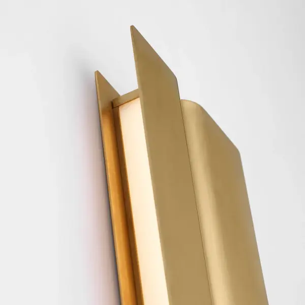 The Cloak 18" Vanity by Peter Bristol transforms functional lighting into architectural art. Folded metal forms conceal the light source while directing illumination with precision, eliminating glare in compact spaces. - alternate view