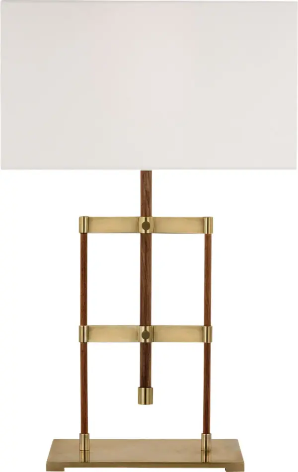 The Alda combines functional adjustability with refined materials, featuring antique-burnished brass paired with rich walnut wood. The linen shade provides soft, diffused light perfect for reading or task work.