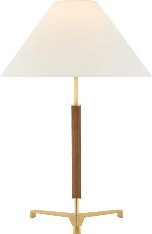 The Amaya table lamp combines antique-burnished brass with rich walnut wood for a refined transitional aesthetic. At 28" tall with a linen shade, it provides elegant ambient lighting for bedrooms and living spaces.