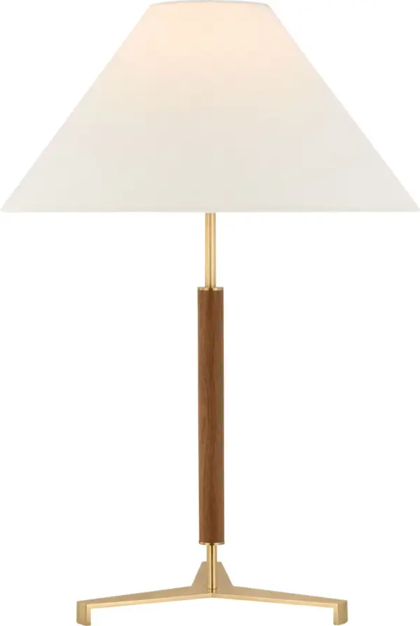 The Amaya table lamp combines antique-burnished brass with rich walnut wood for a refined transitional aesthetic. At 28" tall with a linen shade, it provides elegant ambient lighting for bedrooms and living spaces. - alternate view