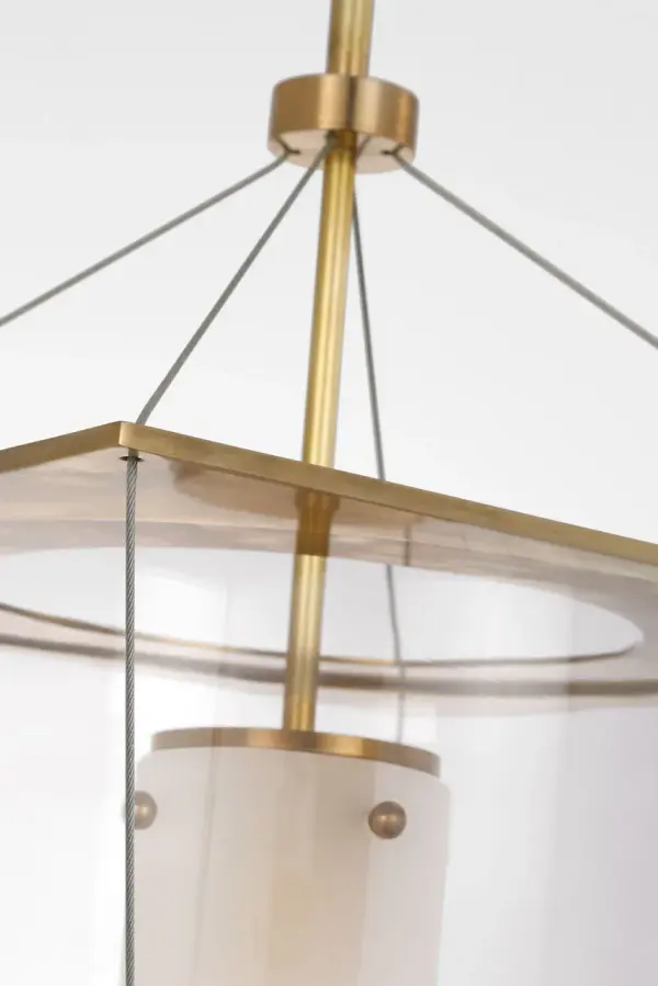 The Ovalle 13" Lantern combines traditional lantern styling with an elegant antique-burnished brass finish and clear glass panels. Perfect for entryways and transitional spaces seeking refined illumination. - alternate view