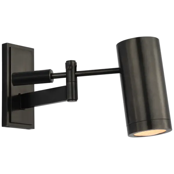 The Grant wall light by Ralph Lauren combines maritime heritage with industrial design through its domed shade and prismatic glass lens. The articulating arm offers flexibility, while bronze and chocolate leather finishes add warmth and sophistication.