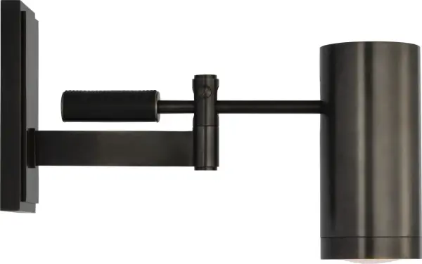 The Grant wall light by Ralph Lauren combines maritime heritage with industrial design through its domed shade and prismatic glass lens. The articulating arm offers flexibility, while bronze and chocolate leather finishes add warmth and sophistication. - alternate view