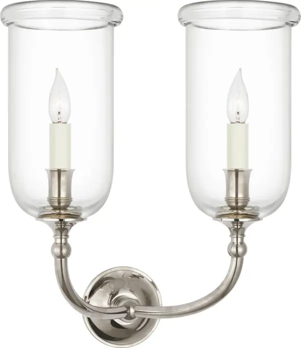 The Embers 20" Double Hurricane Sconce combines classic hurricane styling with refined Butler's Silver finish. Its dual-light design provides substantial illumination while clear glass shades create beautiful ambient glow. - alternate view