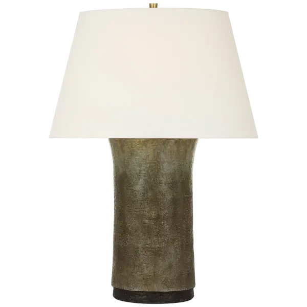 The Damson table lamp combines handcrafted ceramic artistry with transitional design. Its tobacco stoneware finish and natural linen shade create warm, inviting ambiance perfect for residential and hospitality settings.