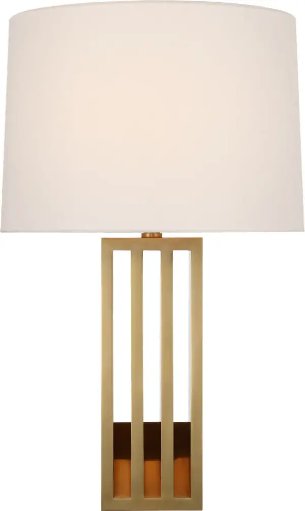 The Penrose table lamp combines warm natural brass with a soft white paper shade for sophisticated ambient lighting. At 29" tall, it makes a statement without overwhelming spaces, perfect for traditional and contemporary interiors alike.