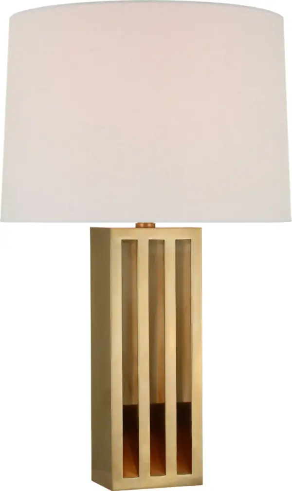 The Penrose table lamp combines warm natural brass with a soft white paper shade for sophisticated ambient lighting. At 29" tall, it makes a statement without overwhelming spaces, perfect for traditional and contemporary interiors alike. - alternate view