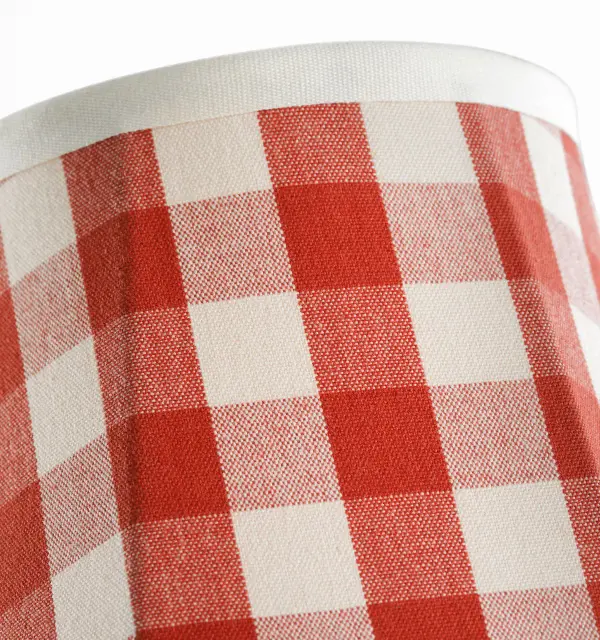This 6-inch soft empire shade features Schumacher's iconic Elton Check pattern in red, bringing traditional elegance and warmth to table lamps. The fabric construction provides soft, diffused light perfect for intimate settings. - alternate view