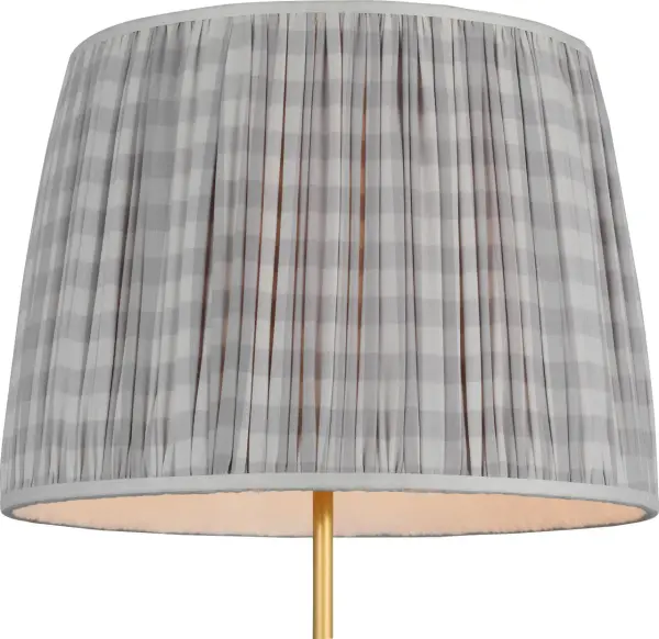 This 16-inch pleated empire shade from Schumacher features a delightful lilac check pattern that brings soft color and classic style to table lamps. The pleated fabric construction adds texture and dimension.