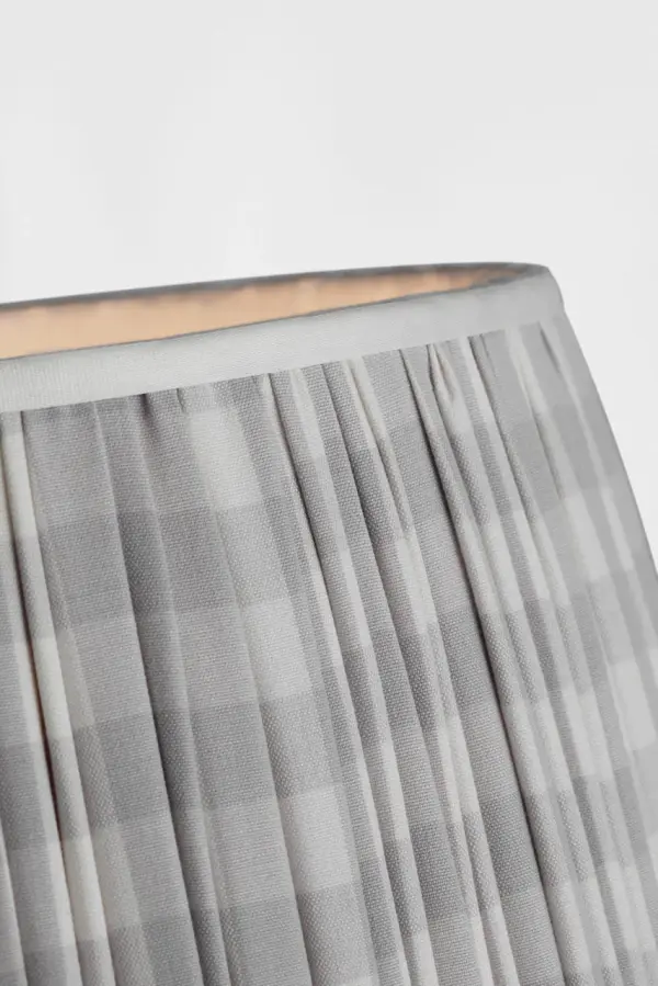 This 16-inch pleated empire shade from Schumacher features a delightful lilac check pattern that brings soft color and classic style to table lamps. The pleated fabric construction adds texture and dimension. - alternate view