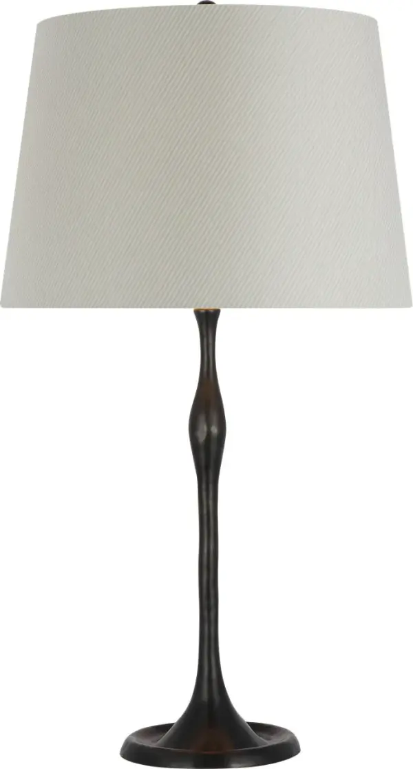 The Romero Medium Table Lamp combines timeless bronze metalwork with a distinctive Schumacher blue striped empire shade, creating a sophisticated accent piece that bridges traditional and coastal aesthetics.