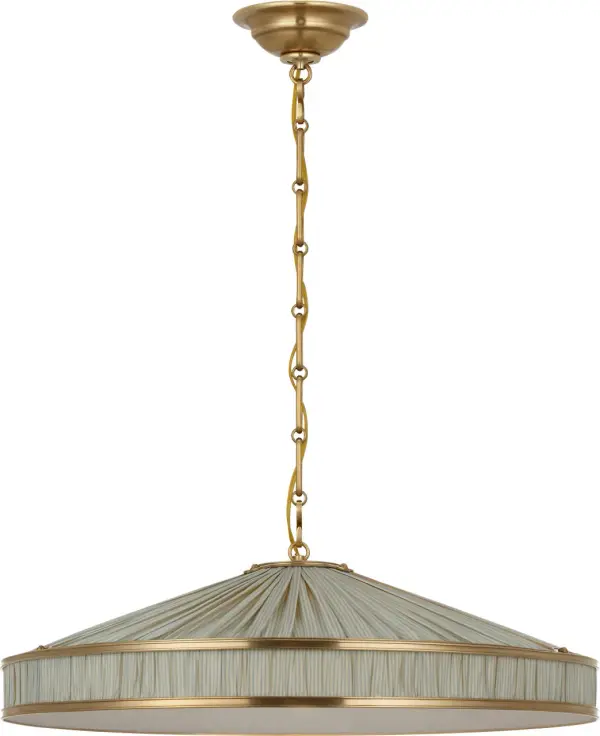 The Allister combines classic galleried metalwork with exclusive Schumacher pleated fabric in a sophisticated blue stripe pattern. At 24 inches, it provides substantial presence while the hand-rubbed antique brass finish adds warmth and timeless appeal.