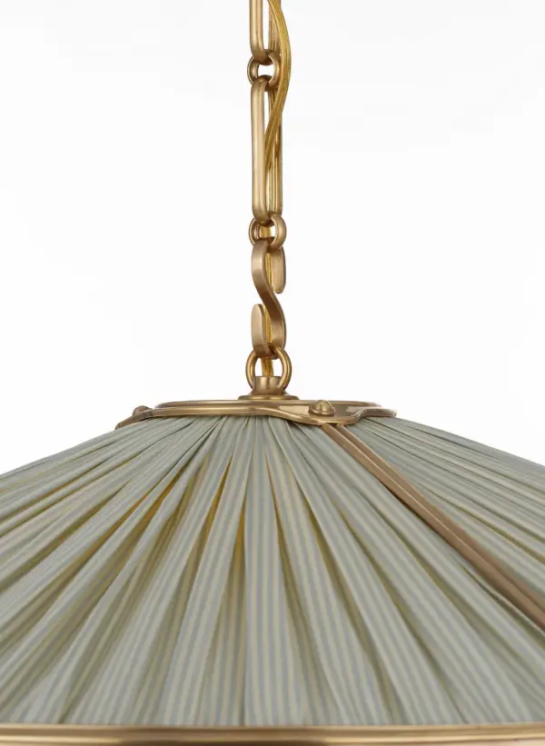 The Allister combines classic galleried metalwork with exclusive Schumacher pleated fabric in a sophisticated blue stripe pattern. At 24 inches, it provides substantial presence while the hand-rubbed antique brass finish adds warmth and timeless appeal. - alternate view