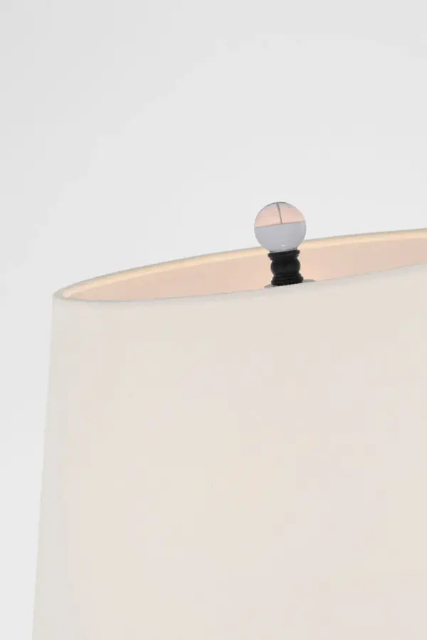 The Wyatt 52" floor lamp combines traditional bronze metalwork with a soft linen shade, creating versatile ambient lighting. Its transitional design bridges classic and contemporary aesthetics, making it adaptable to various interior styles. - alternate view