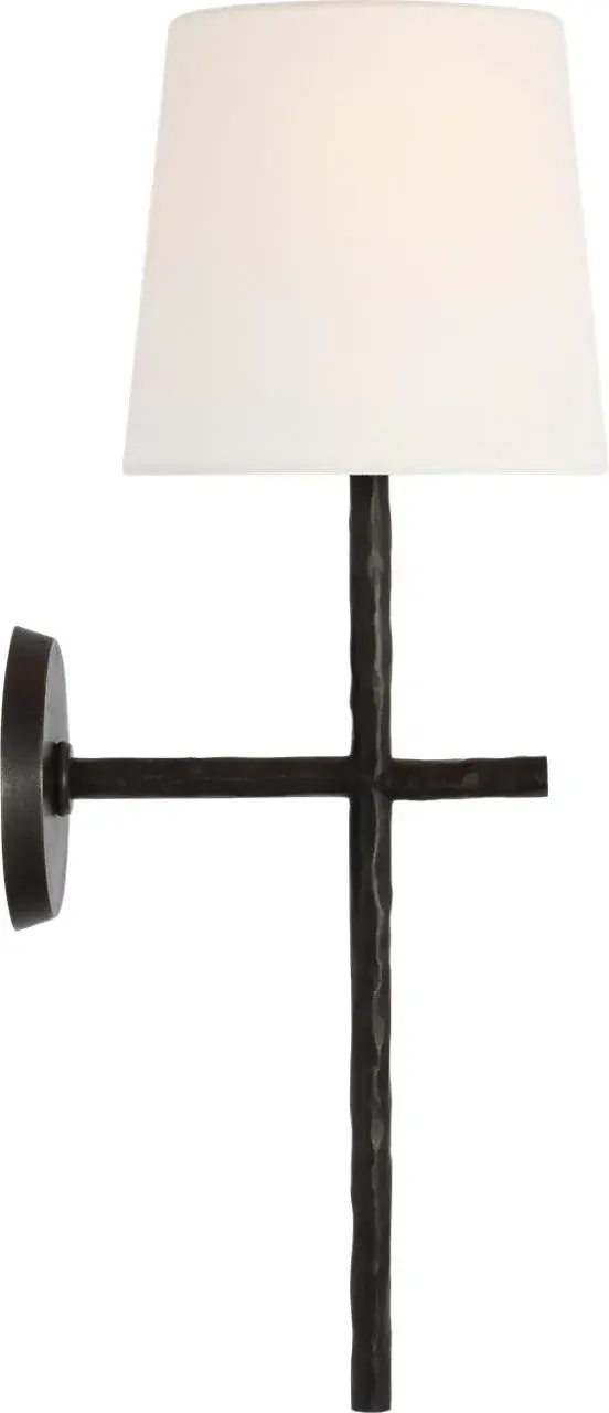 The Collette 23" Tail Sconce combines aged iron metalwork with a soft linen shade, creating a sophisticated lighting solution that works beautifully in traditional and transitional spaces. Its extended tail design adds architectural interest.
