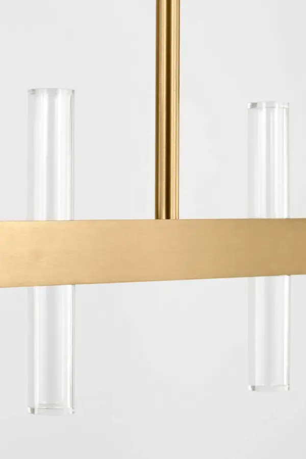 The Silas 56" Linear Chandelier combines transitional elegance with contemporary scale. Twenty lights arranged along a burnished brass frame create dramatic illumination perfect for large dining spaces and kitchen islands. - alternate view