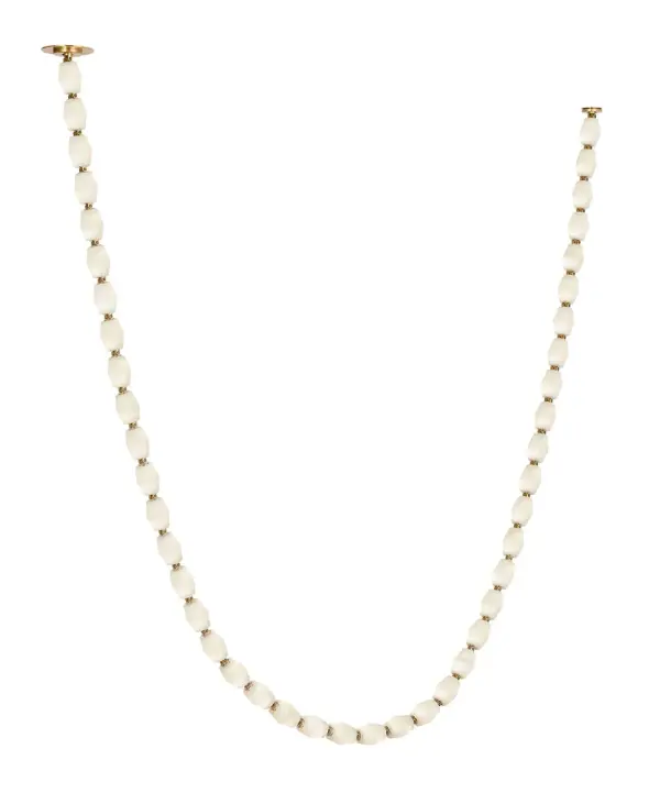 The Collier 132-inch linear chandelier makes a dramatic architectural statement with its impressive scale and warm alabaster diffusers. The hand-rubbed antique brass finish adds timeless elegance, while integrated 3000K LED provides warm, inviting illumination perfect for large dining spaces and grand interiors.