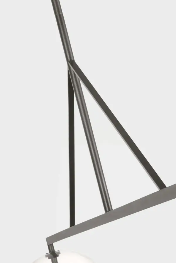 The Leano 61" Linear Chandelier combines solid brass construction with hand-cut ribbed glass shades for a refined contemporary statement. Its linear form and precision-crafted details create sophisticated illumination. - alternate view