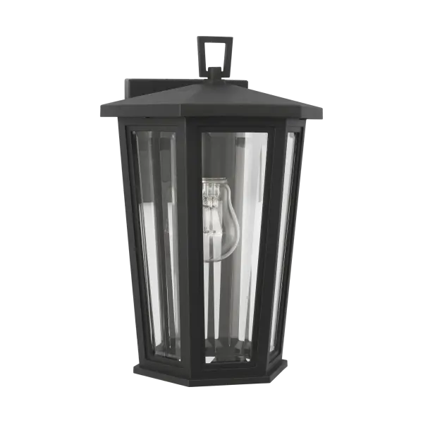 The Witley Small Wall Lantern combines contemporary geometric styling with traditional outdoor functionality. Its faceted clear glass and textured black frame create a striking visual statement while providing durable, wet-rated performance for any exterior space. - alternate view