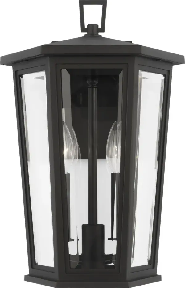 The Witley Medium Wall Lantern combines faceted clear glass with a textured black frame for striking outdoor illumination. Its geometric form and industrial charm make it perfect for contemporary homes seeking statement lighting.