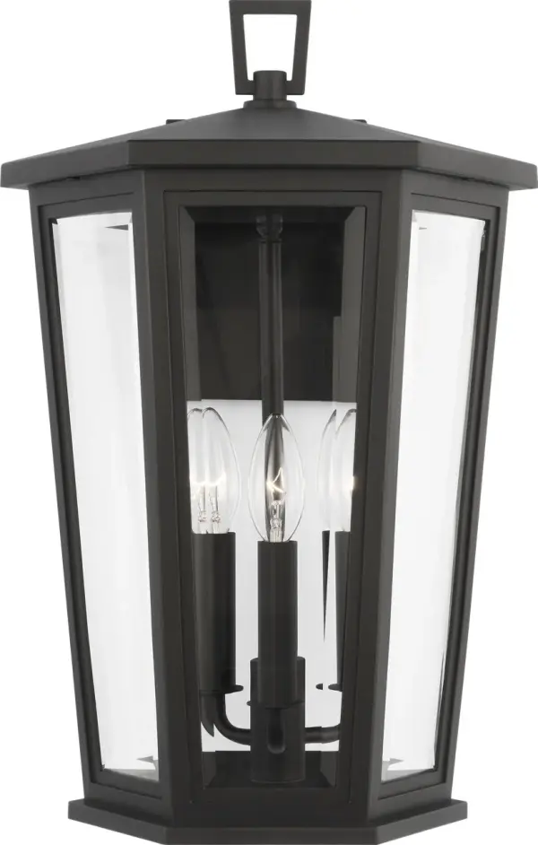 The Witley Large Wall Lantern combines sleek angular design with durable wet-rated construction. Its distinctive trapezoidal shape and clear glass panels create refined illumination perfect for modern and transitional exteriors.