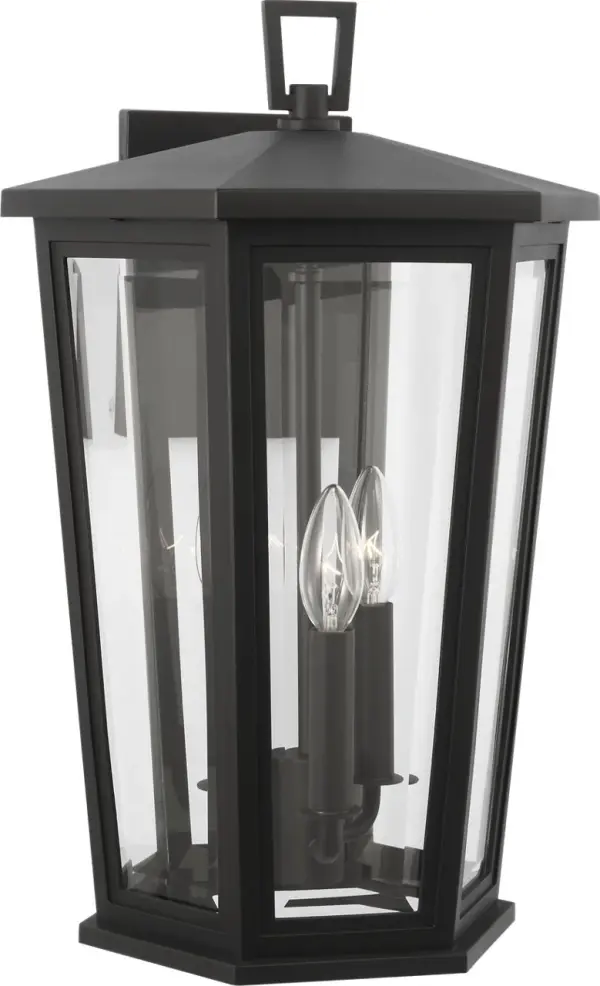 The Witley Large Wall Lantern combines sleek angular design with durable wet-rated construction. Its distinctive trapezoidal shape and clear glass panels create refined illumination perfect for modern and transitional exteriors. - alternate view