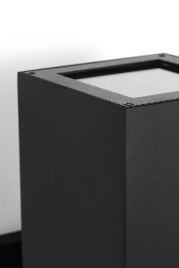 The Pohl StoneStrong Large Lantern combines traditional lantern styling with weather-resistant construction. Its textured black finish and substantial size make it ideal for exterior entryways and covered outdoor spaces. - alternate view