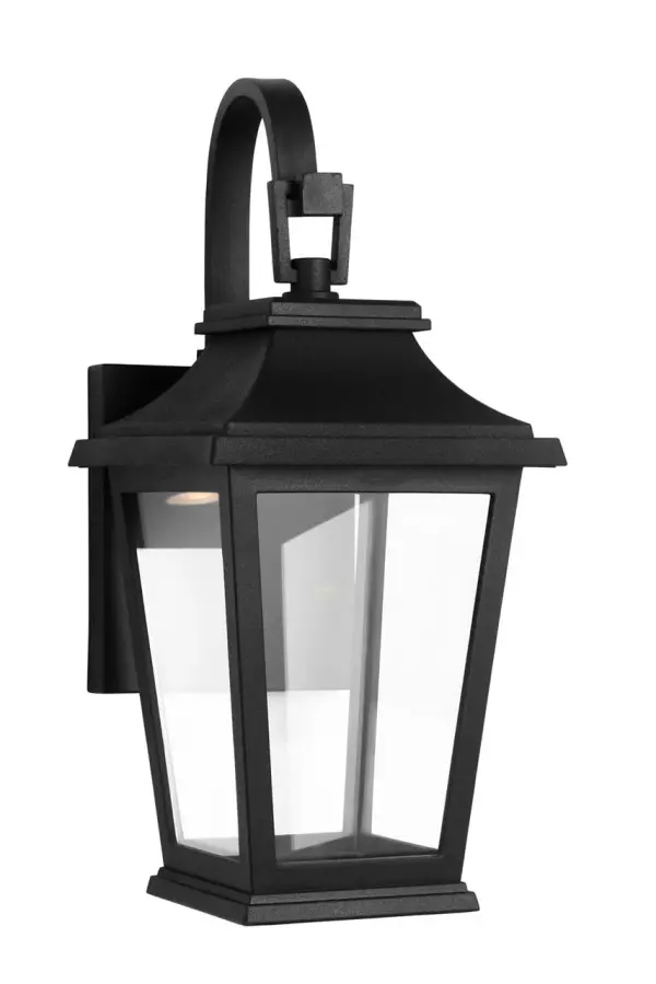 The Warren Mini Lantern combines traditional lantern styling with a durable textured black finish, perfect for adding classic charm to entryways, porches, and patios. Its compact size makes it ideal for smaller outdoor areas. - alternate view