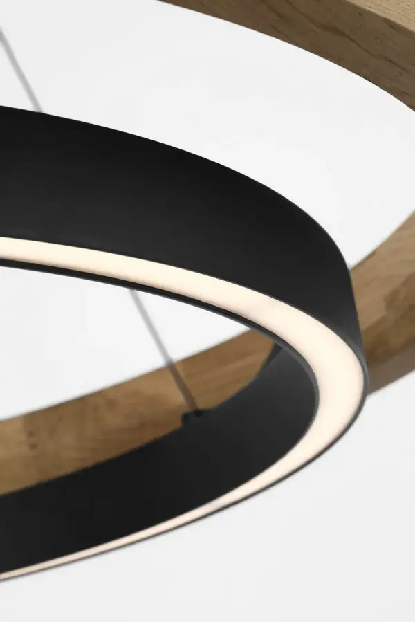 The Grace 30" Outdoor Chandelier combines solid teak wood with textured black metal in a striking concentric ring design. Integrated LED lights provide bi-directional illumination while the teak naturally patinas to a silvered finish over time. - alternate view