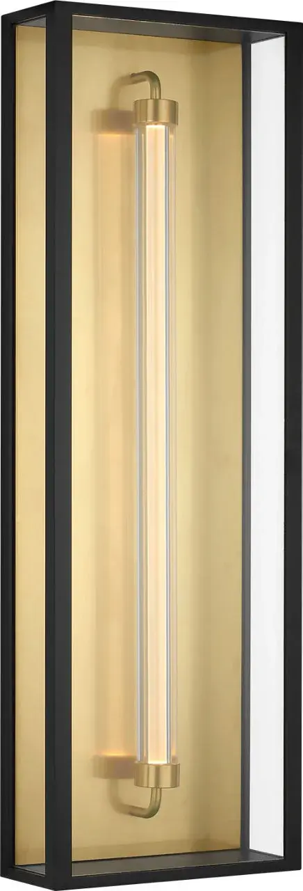 The Enferme 29" Wall Sconce delivers striking architectural presence with its elongated 29-inch profile and layered glass construction. Integrated LED mimics Edison warmth while Hand-Rubbed Antique Brass details add refined contrast to the Outdoor Black finish.