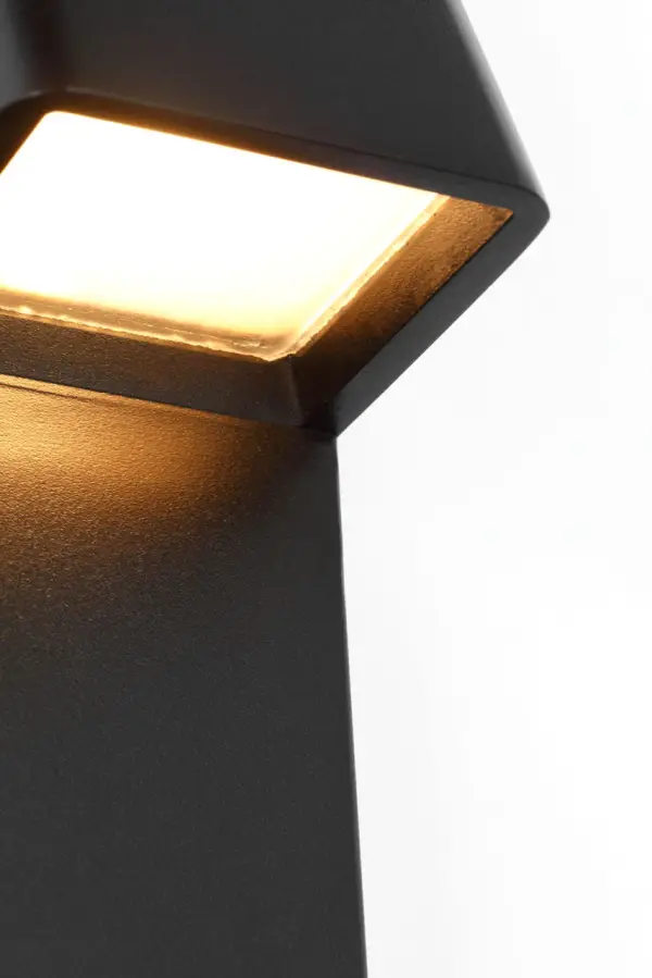 The Froler 17" Wall Sconce by Sean Lavin delivers seamless architectural integration with its mud-in installation system. Engineered for outdoor use, it provides precise downward illumination while washing the elongated plate below in a defined glow—perfect for entryways and pathways. - alternate view