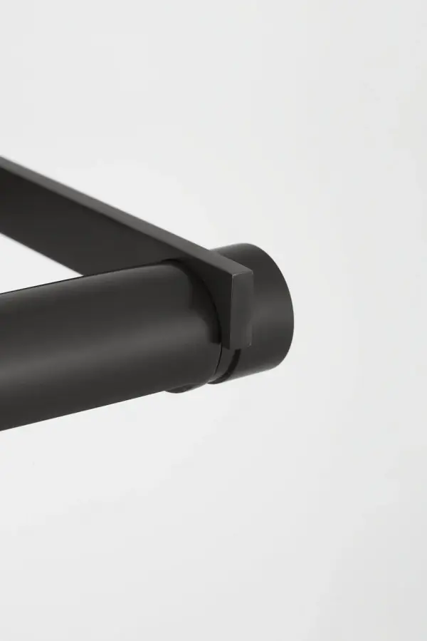 The Katan 24" picture light combines minimalist design with functional elegance. Its pivoting cylindrical light source within a rectangular frame delivers even, soft illumination perfect for showcasing art without glare. - alternate view