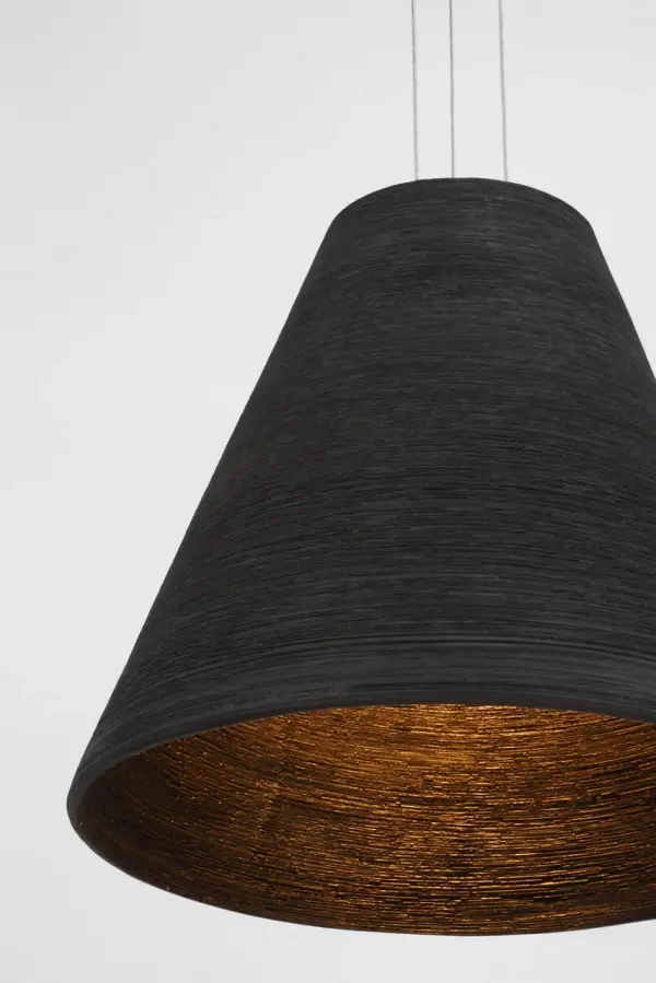 The Karam Tapered Medium Pendant combines contemporary design with timeless brass craftsmanship. Its black natural brass finish offers rich depth and warmth, while the 2700K color temperature and 90 CRI provide exceptional light quality. - alternate view