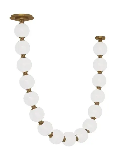 The Perle LED Pendant by Sean Lavin offers stunning design versatility with soft milk glass and natural brass connectors. Can be hung as a single pendant or draped between mounting points for dramatic effect.