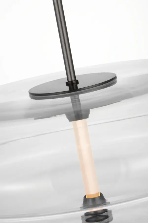 The Shakkei Double X-Large Pendant makes a bold architectural statement with its clear bronze finish and substantial scale. Perfect for grand spaces requiring dramatic lighting, this fixture combines organic forms with contemporary sophistication. - alternate view