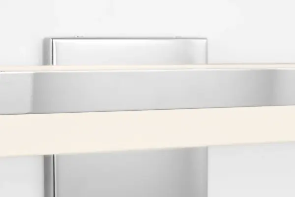 The Ismay 36-inch bath light delivers contemporary elegance with its polished chrome finish and clean lines. Perfect for medium to large vanities, this fixture provides ample illumination while adding a sophisticated touch to any bathroom. - alternate view