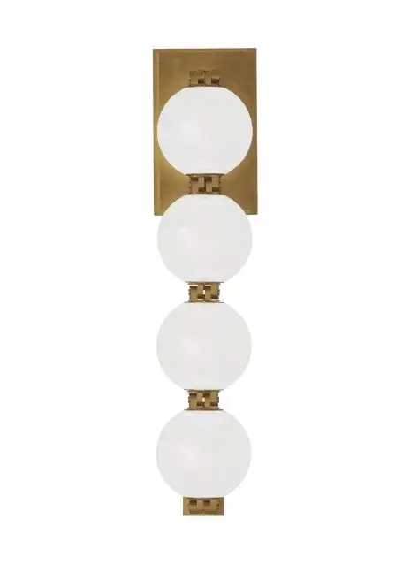 The Perle LED Wall Sconce by Sean Lavin combines contemporary design with functional lighting. Its soft milk glass shade and natural brass connectors create a refined aesthetic perfect for modern interiors.
