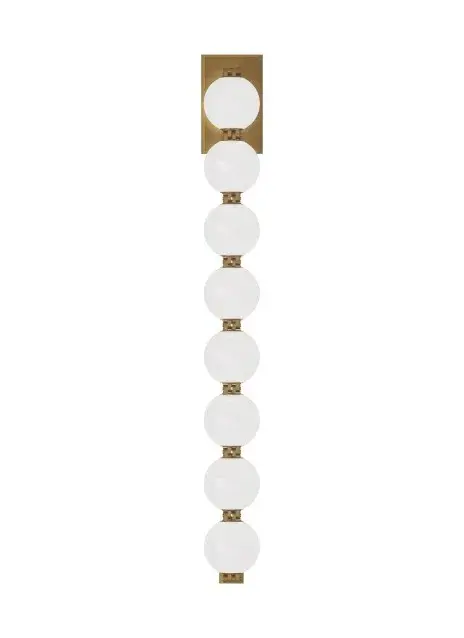 The Perle LED Wall Sconce by Sean Lavin brings contemporary elegance with its milk glass strand and natural brass connectors. Part of the acclaimed Collier Series extension, it offers warm 2700K LED illumination with excellent color rendering.