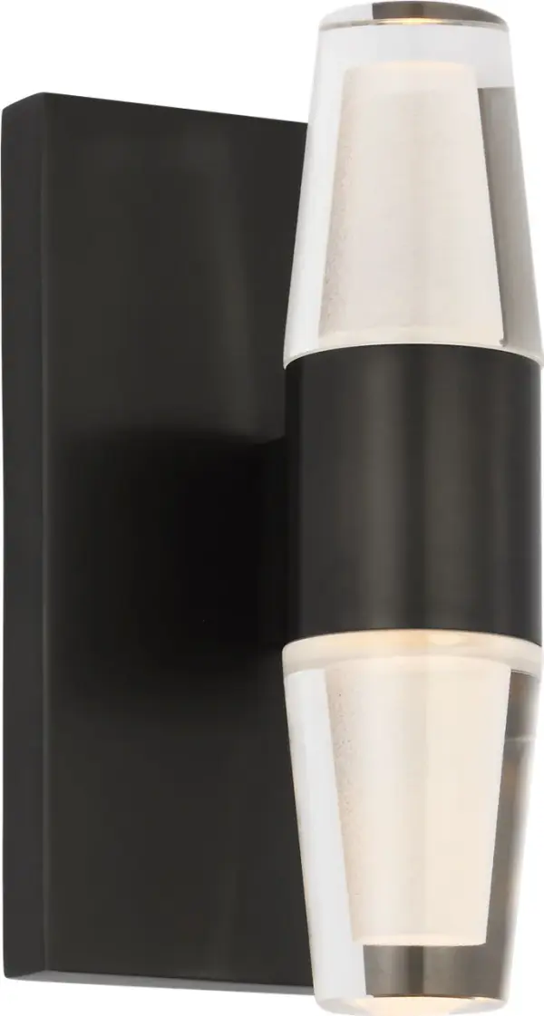 The Lassell Single Short Sconce combines minimalist design with luxurious materials. Featuring laser-etched crystal tubes and dark bronze hardware, it delivers sophisticated ambient lighting perfect for modern interiors. - alternate view