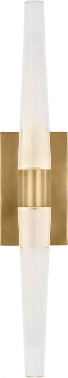 The Lassell Single Tall Sconce combines delicate natural brass arms with laser-etched crystal tubes for a stunning modern statement. Its oversized scale and minimalist design make it perfect for contemporary spaces seeking a luxurious focal point.