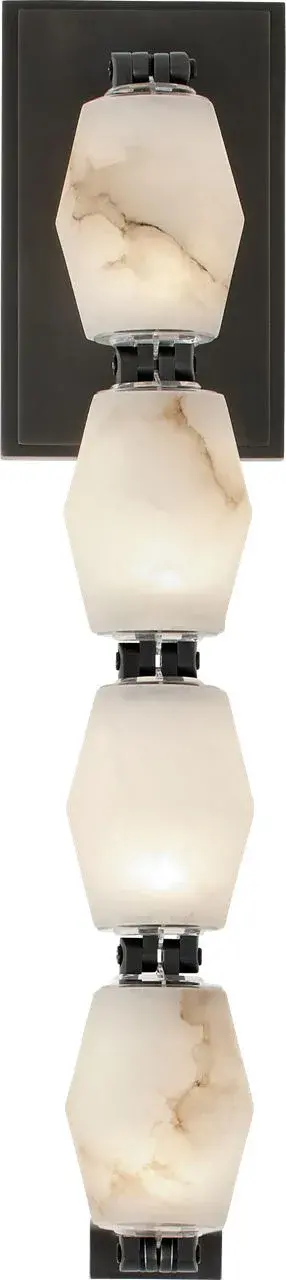 The Collier sconce combines natural alabaster with a refined bronze finish, creating sophisticated ambient lighting. At 15 inches, it provides substantial presence while maintaining versatility across residential and hospitality settings. - alternate view