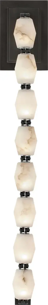 The Collier sconce makes a bold statement with its impressive 28-inch height and natural alabaster shade. The warm bronze finish complements the translucent stone beautifully, creating sophisticated ambient lighting for larger spaces.