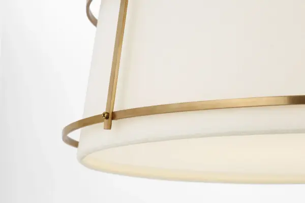 The Callaway 18" flush mount combines classic hand-rubbed antique brass with a sophisticated linen shade and frosted acrylic diffuser. Its transitional design bridges traditional and contemporary aesthetics, making it versatile for various interiors while providing soft, diffused illumination. - alternate view