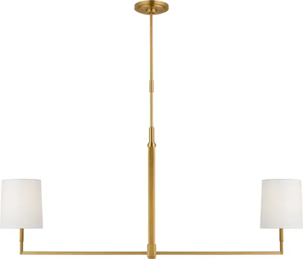The Danica Large Linear Chandelier brings refined elegance to dining and living spaces with its burnished brass finish and elongated silhouette. Perfect for modern and transitional interiors seeking statement lighting.